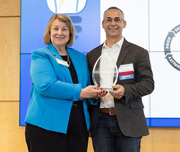 Butch Gaudet (right) receives the Award on behalf of PowerRail